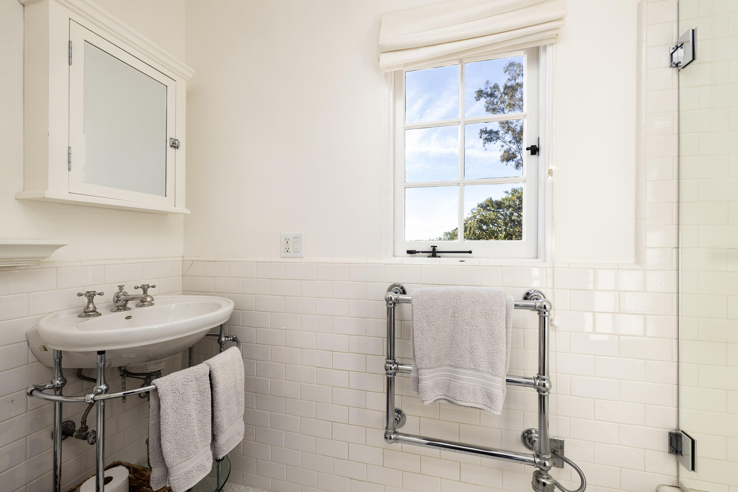 1933 Mission Ridge Road Santa Barbara, CA 93103 - Photo 18 of 30 a bathroom with a sink a mirror and a shower