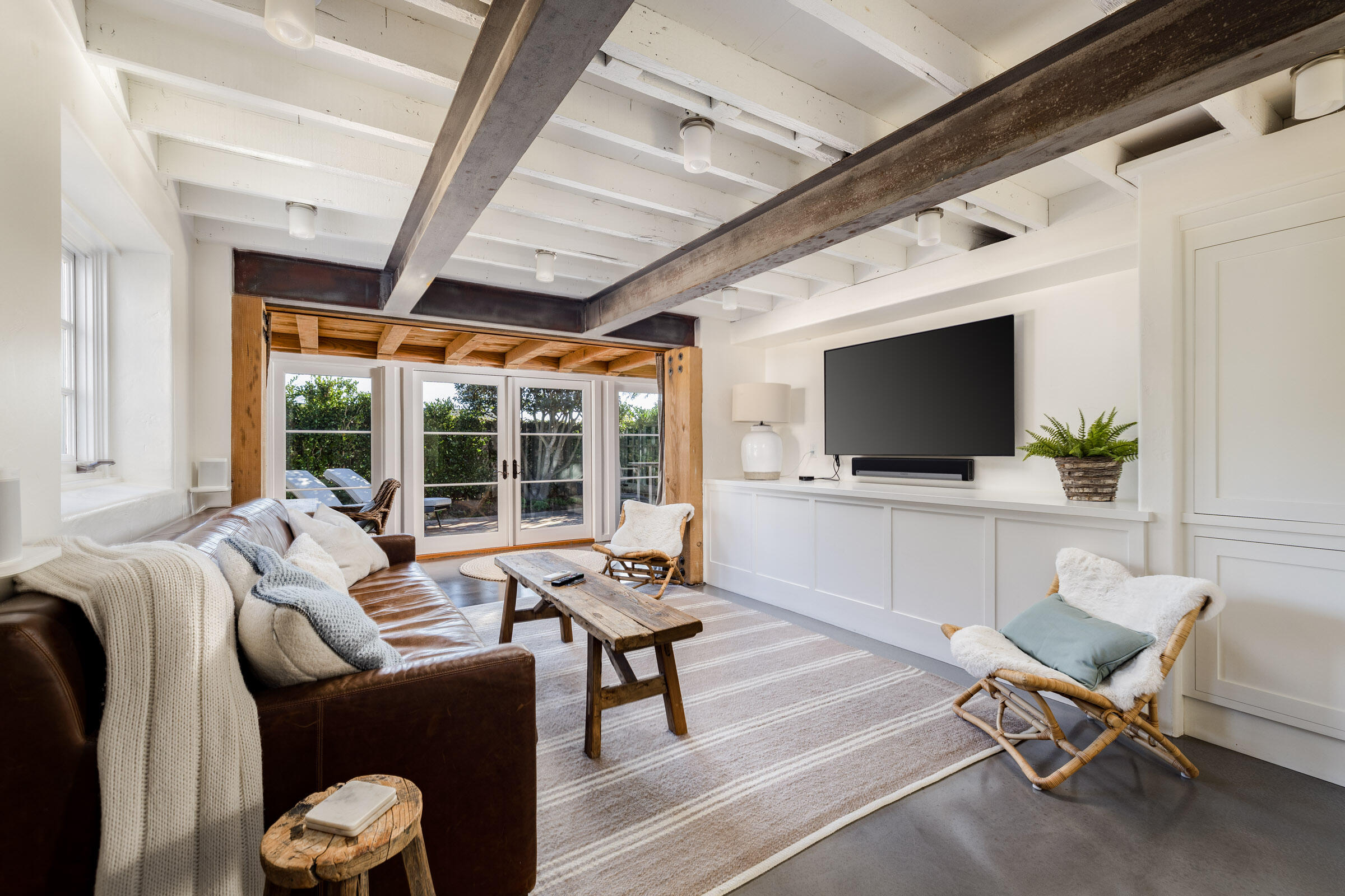 1933 Mission Ridge Road Santa Barbara, CA 93103 - Photo 19 of 30 a living room with furniture a flat screen tv and a floor to ceiling window