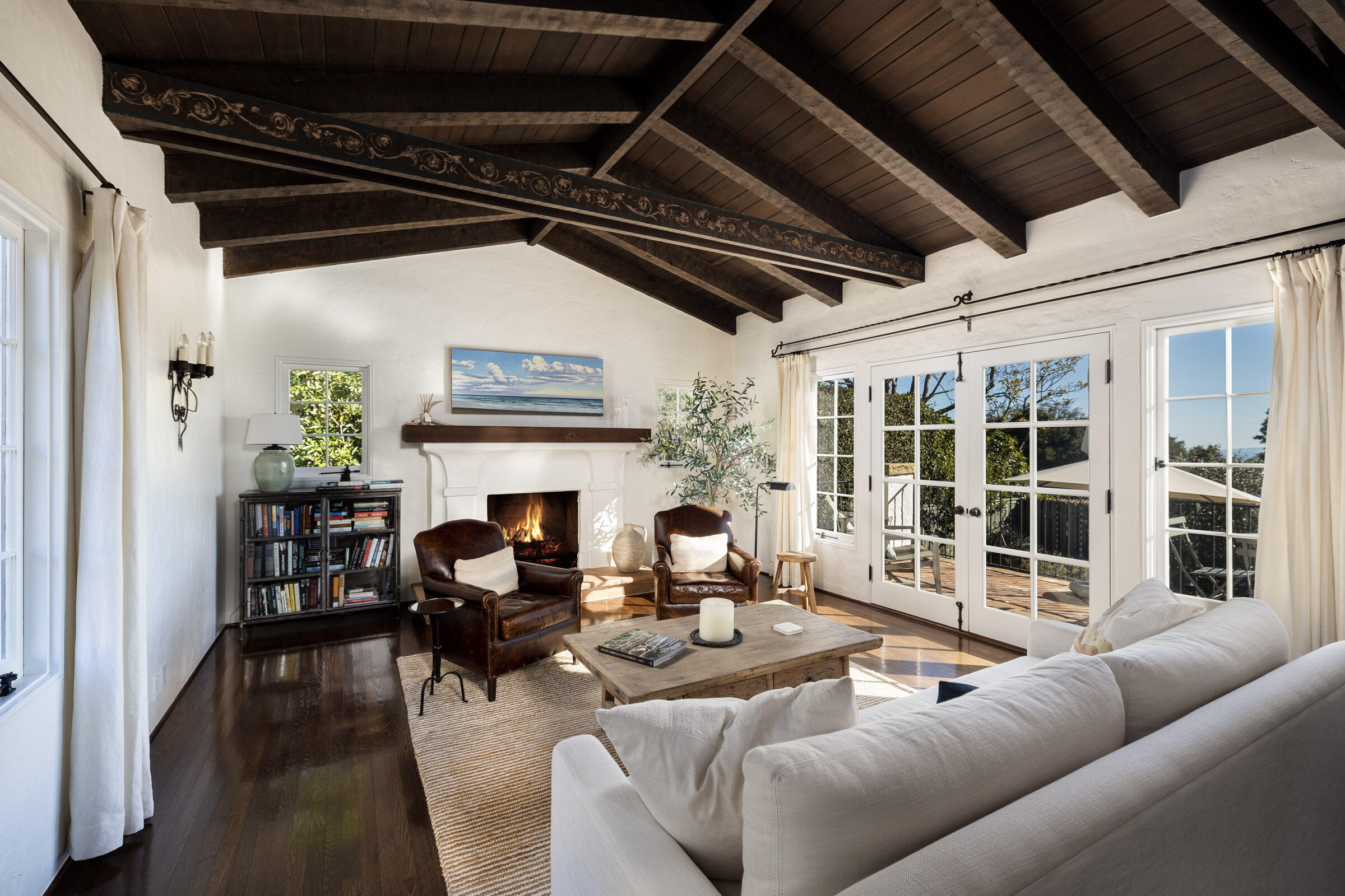 1933 Mission Ridge Road Santa Barbara, CA 93103 - Photo 2 of 30 a living room with furniture a fireplace and a table