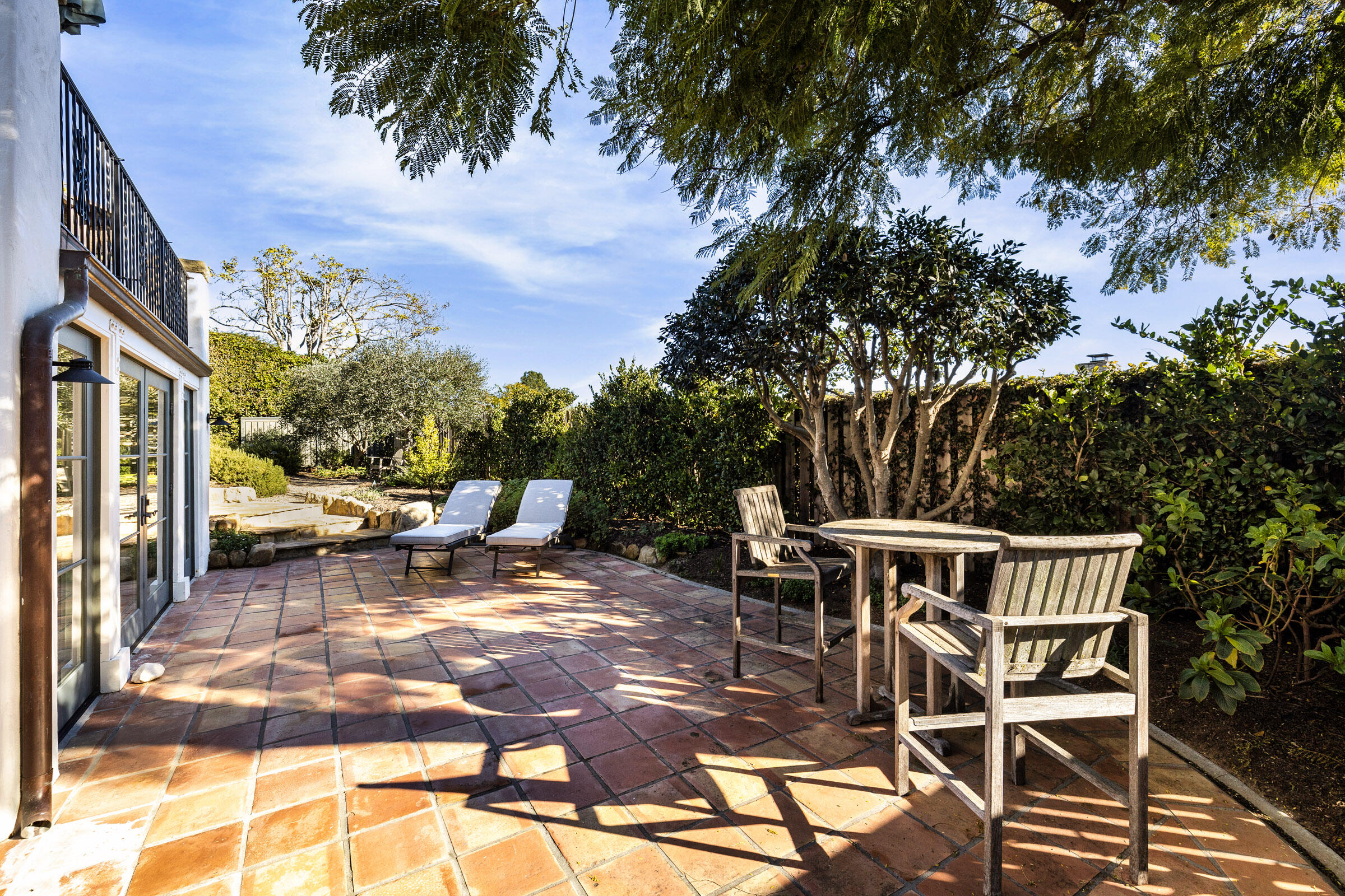 1933 Mission Ridge Road Santa Barbara, CA 93103 - Photo 21 of 30 a view of a patio with a table and chairs and potted plants