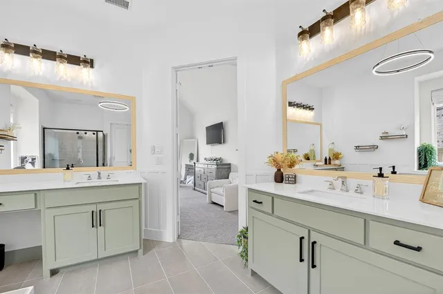 a bathroom with a sink and mirror