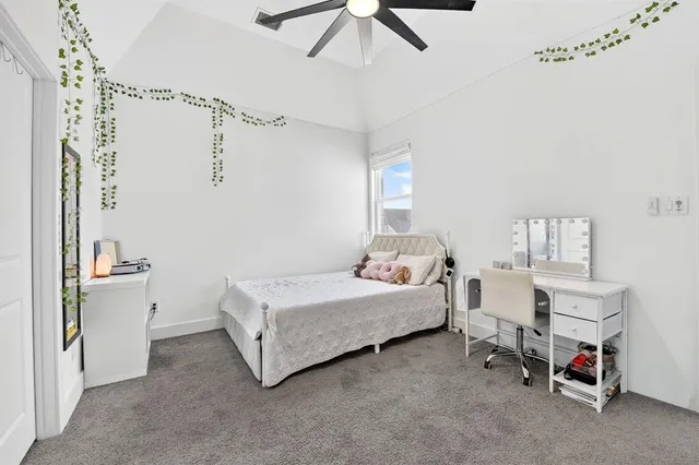 a room with a bed and a chandelier