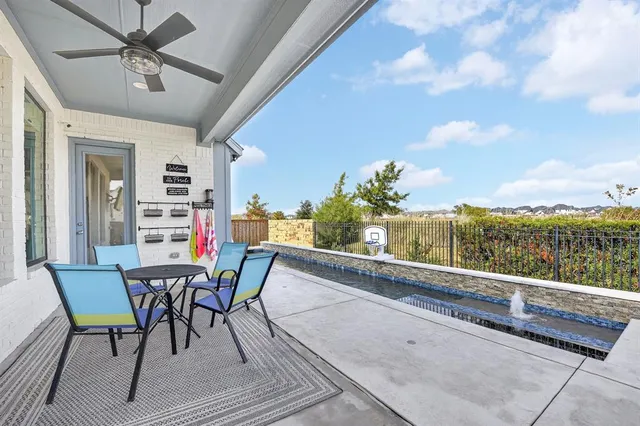 a view of a balcony with furniture