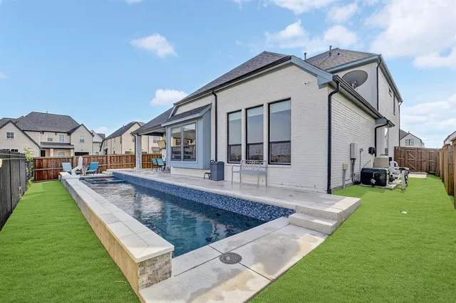 a swimming pool view with a outdoor space