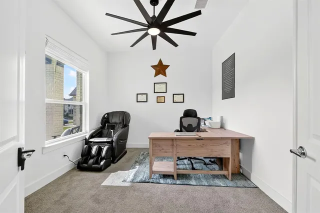 a living room with furniture a window and a chandelier