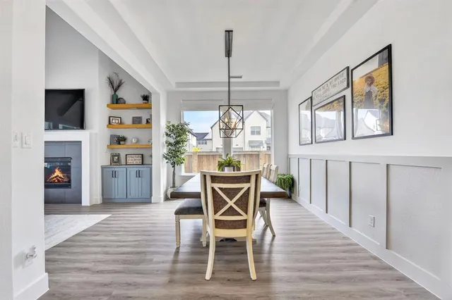 a dining room with furniture and window