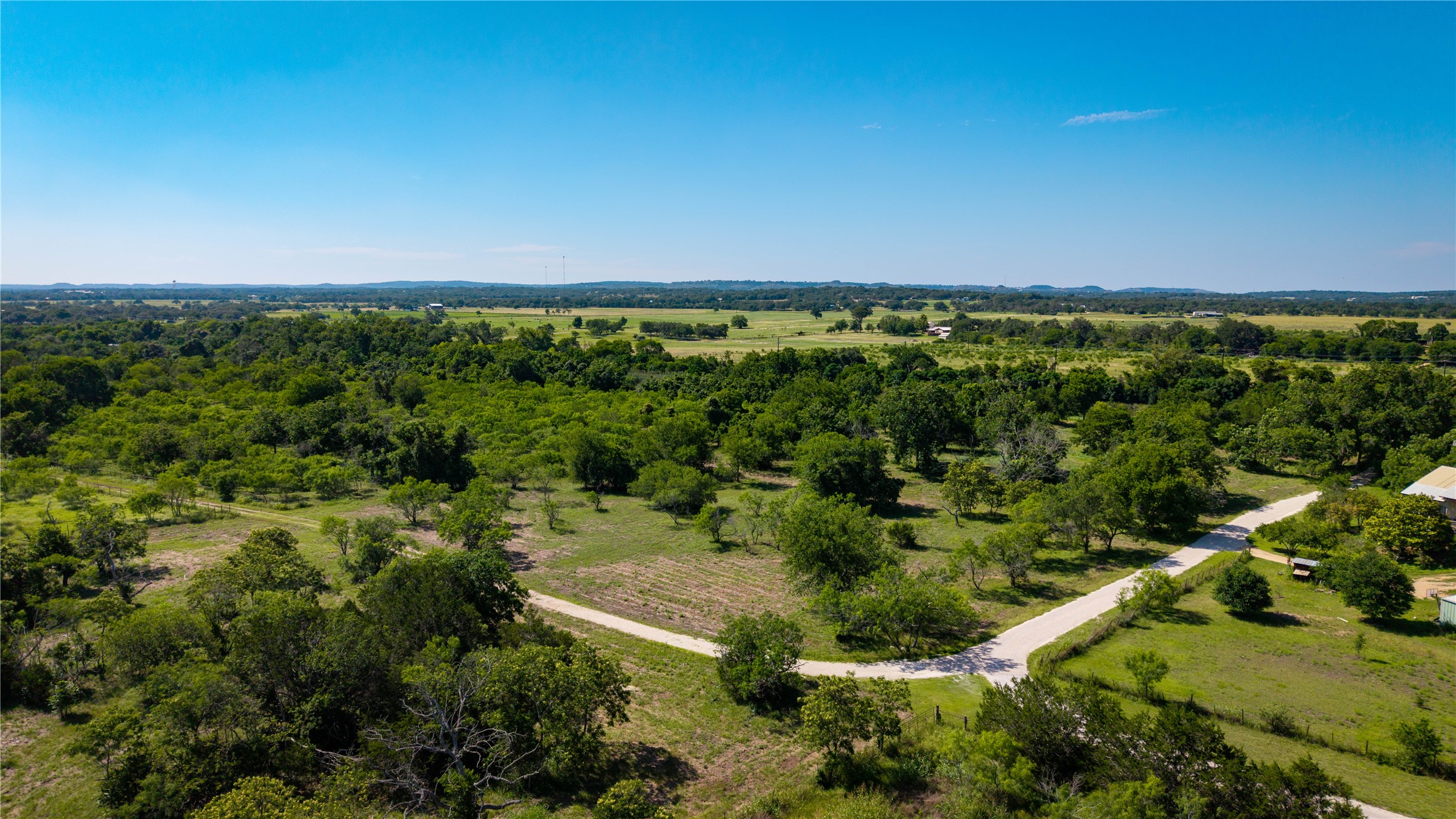 Tbd Lost Acres Loop Blanco, TX 78606 - Photo 38 of 39 a view of a city with lush green forest