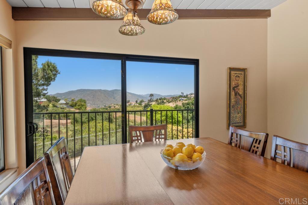 1057 Riverview Drive Fallbrook, CA 92028 - Photo 15 of 69 a living room with furniture and a floor to ceiling window