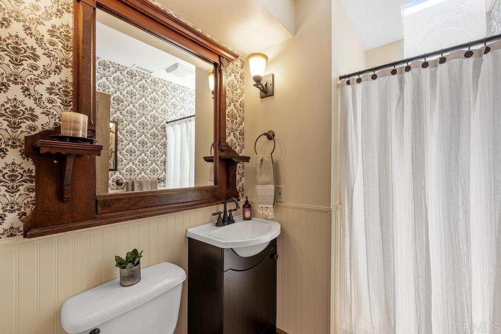 1057 Riverview Drive Fallbrook, CA 92028 - Photo 17 of 69 a bathroom with a sink a mirror and a window