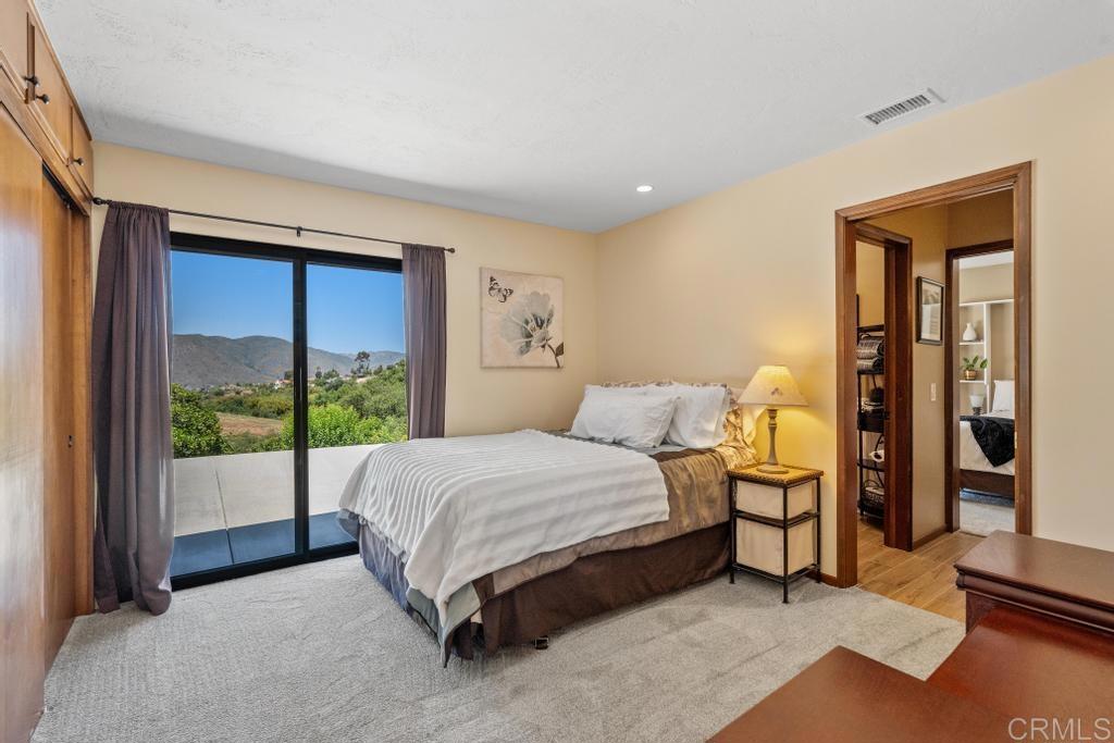 1057 Riverview Drive Fallbrook, CA 92028 - Photo 20 of 69 a bed sitting in a spacious bedroom next to a window