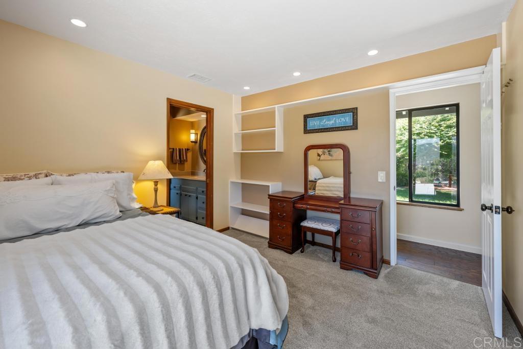 1057 Riverview Drive Fallbrook, CA 92028 - Photo 22 of 69 a bedroom with a bed and a dresser