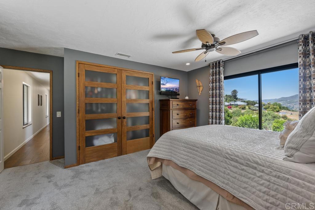 1057 Riverview Drive Fallbrook, CA 92028 - Photo 28 of 69 a bed room with a bed and a television