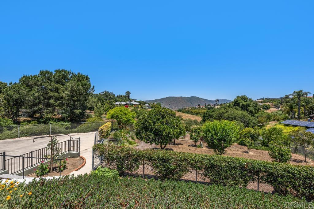 1057 Riverview Drive Fallbrook, CA 92028 - Photo 38 of 69 a view of a garden with a building in the background