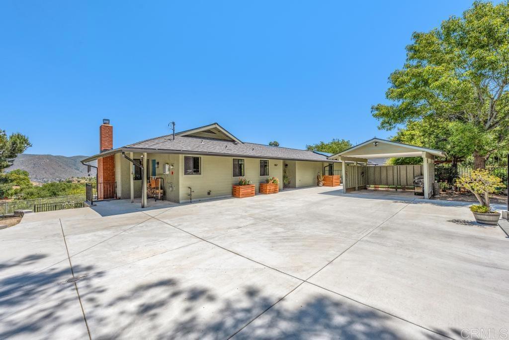 1057 Riverview Drive Fallbrook, CA 92028 - Photo 66 of 69 a front view of a house with a garden
