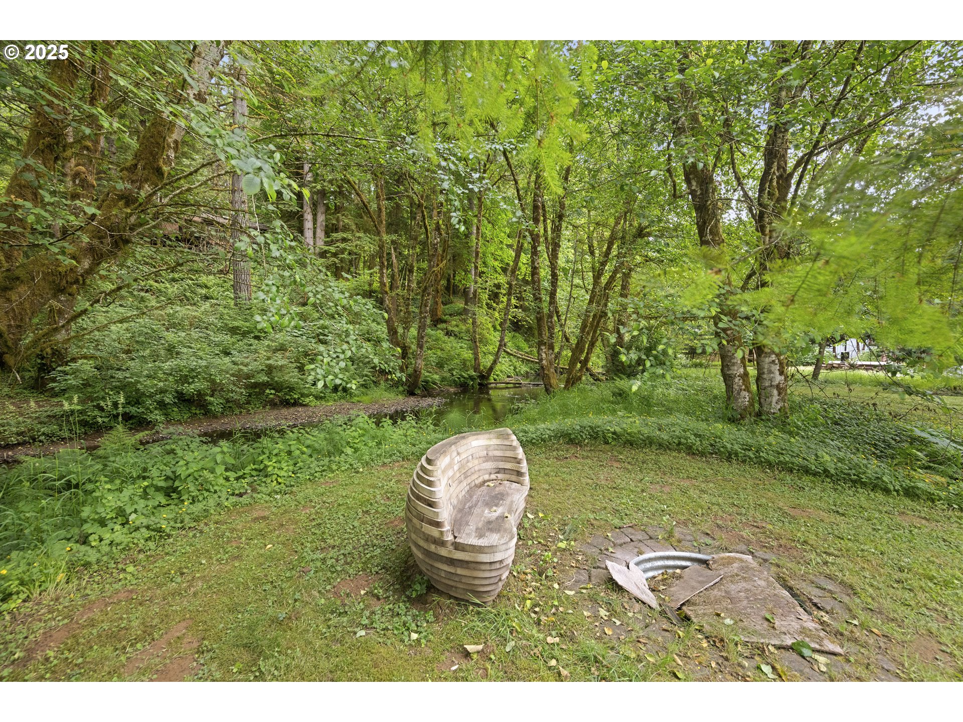 10304 Fieldcrest Drive Birkenfeld, OR 97016 - Photo 5 of 19 a backyard of a house with a yard and outdoor seating