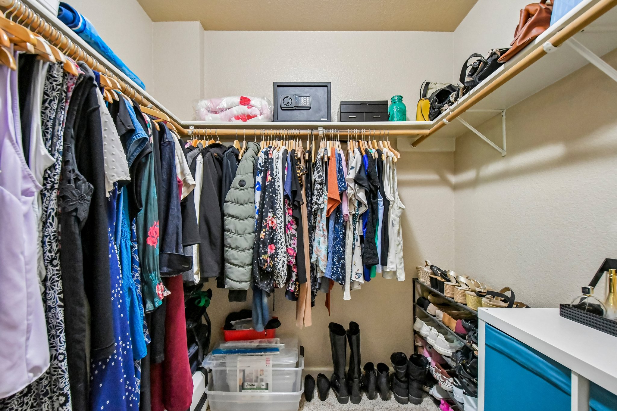 125 Mason Reed Cove Kyle, TX 78640 - Photo 30 of 39 a view of walk in closet with clothes and shoes