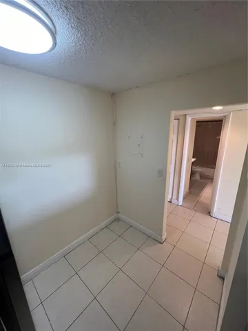 an empty room with mirror