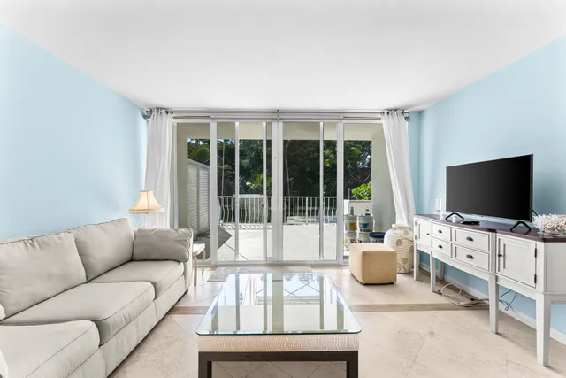 an entryway with furniture and livingroom view
