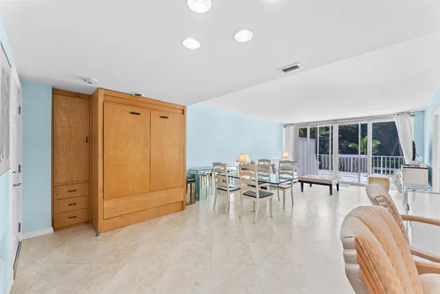 a bedroom with furniture and window