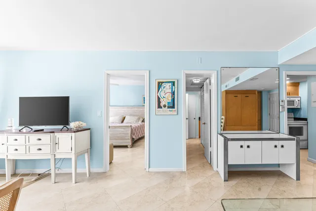 a living room with furniture and large window