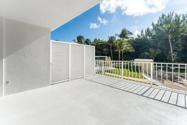 a balcony with wooden floor