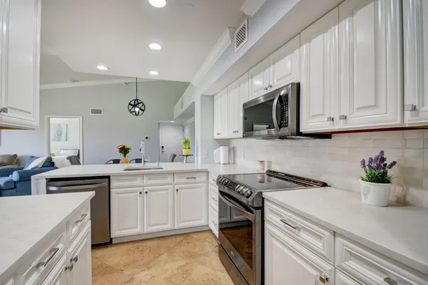 a kitchen with a table and chairs