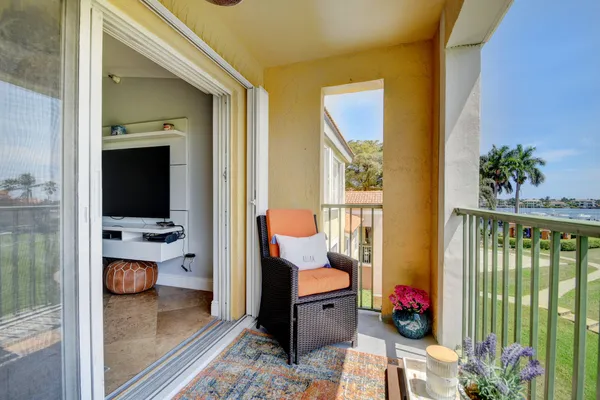 an aerial view of a houses with a lake view