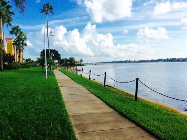 a swimming pool with outdoor seating and yard