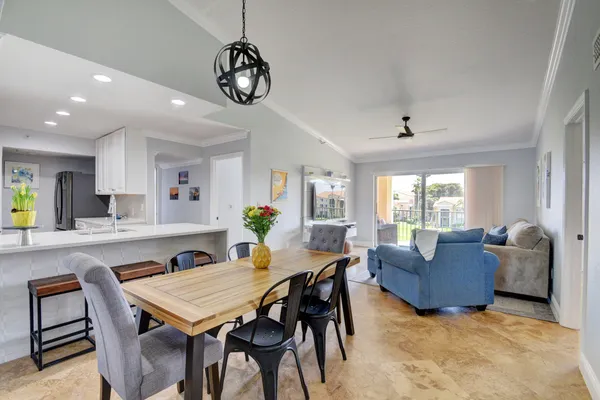 a view of a dining room with furniture and window