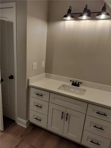 a bathroom with a sink and vanity