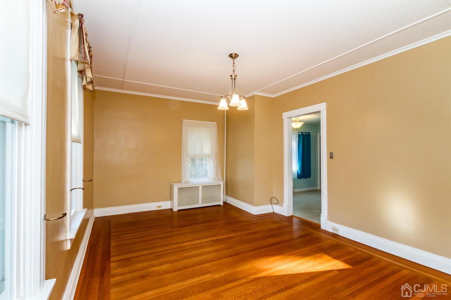 19 Kings Road Netcong, NJ 07857 - Photo 12 of 24 a view of empty room with wooden floor and fan