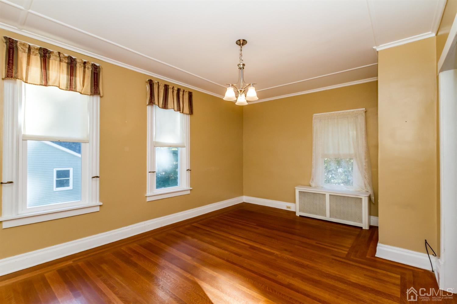 19 Kings Road Netcong, NJ 07857 - Photo 14 of 24 a view of an empty room with window and wooden floor