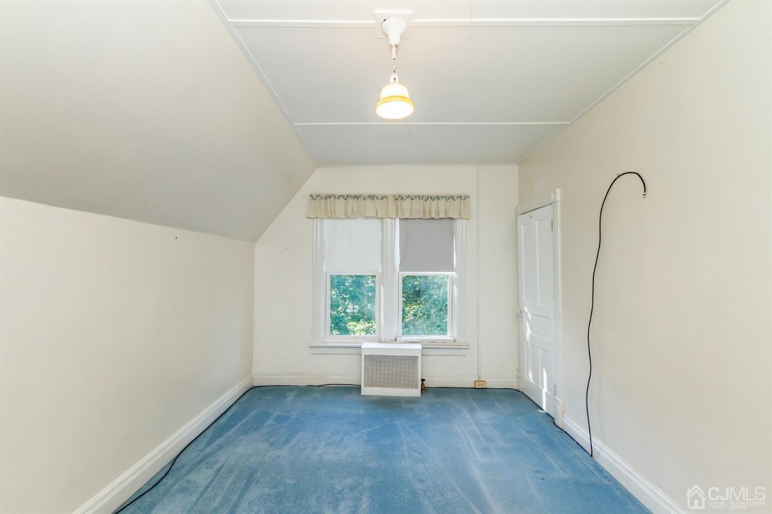 19 Kings Road Netcong, NJ 07857 - Photo 18 of 24 an empty room with wooden floor and windows