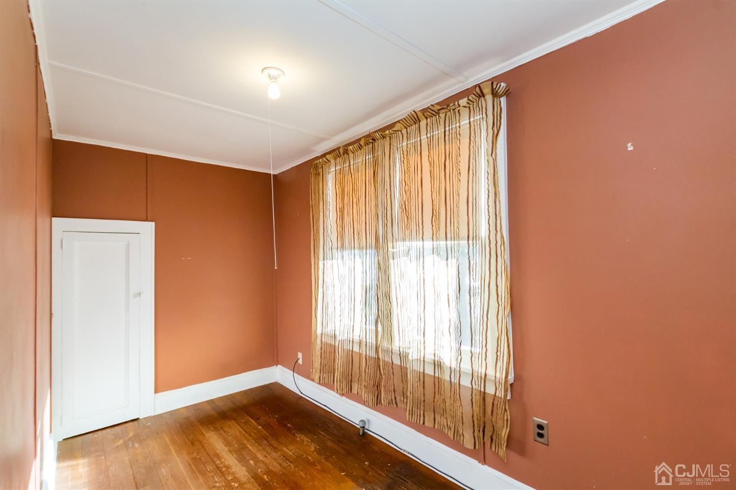 19 Kings Road Netcong, NJ 07857 - Photo 20 of 24 a view of an empty room with wooden floor and a window