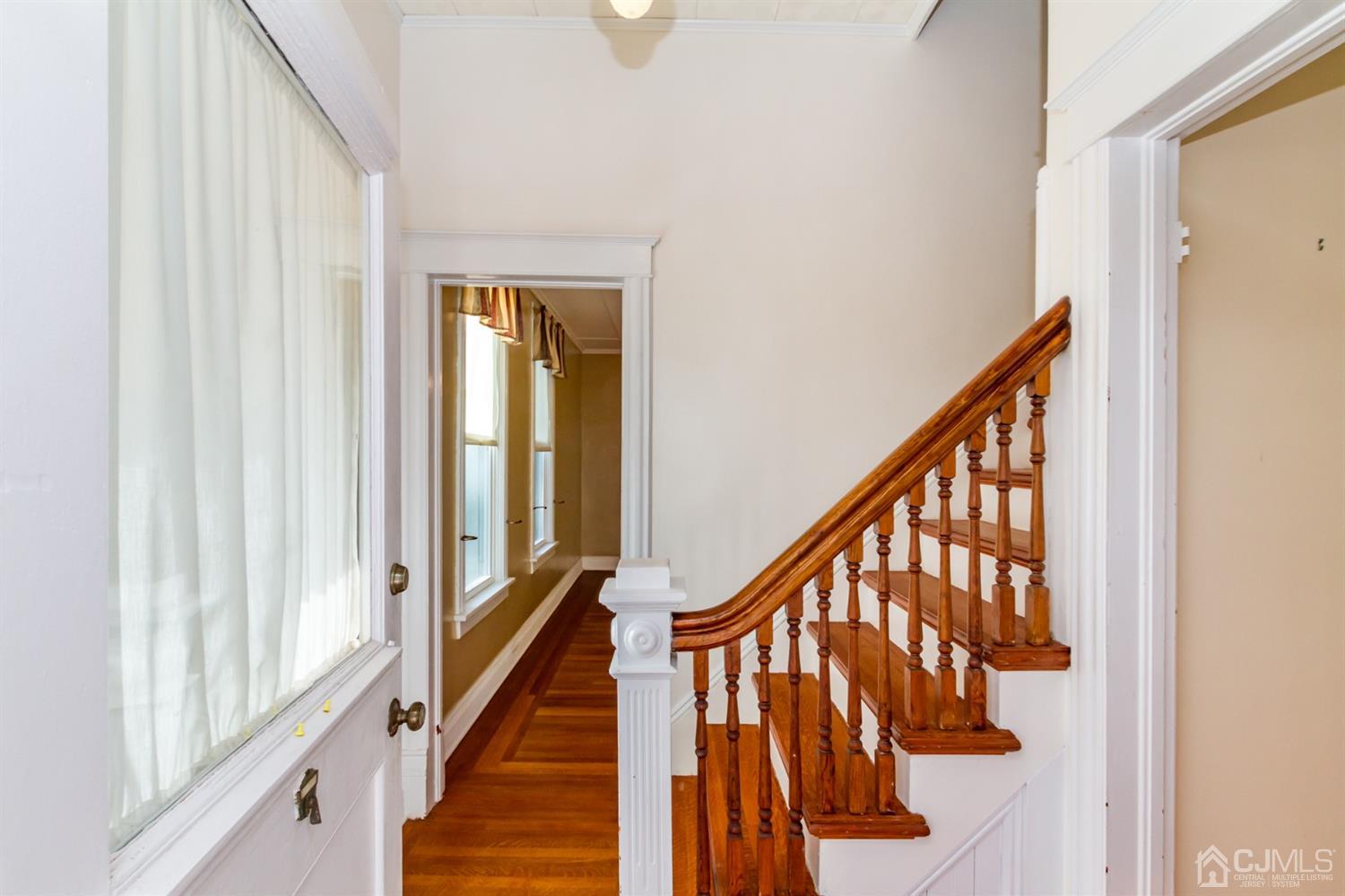 19 Kings Road Netcong, NJ 07857 - Photo 3 of 24 a view of staircase with lots of frames on wall and a window