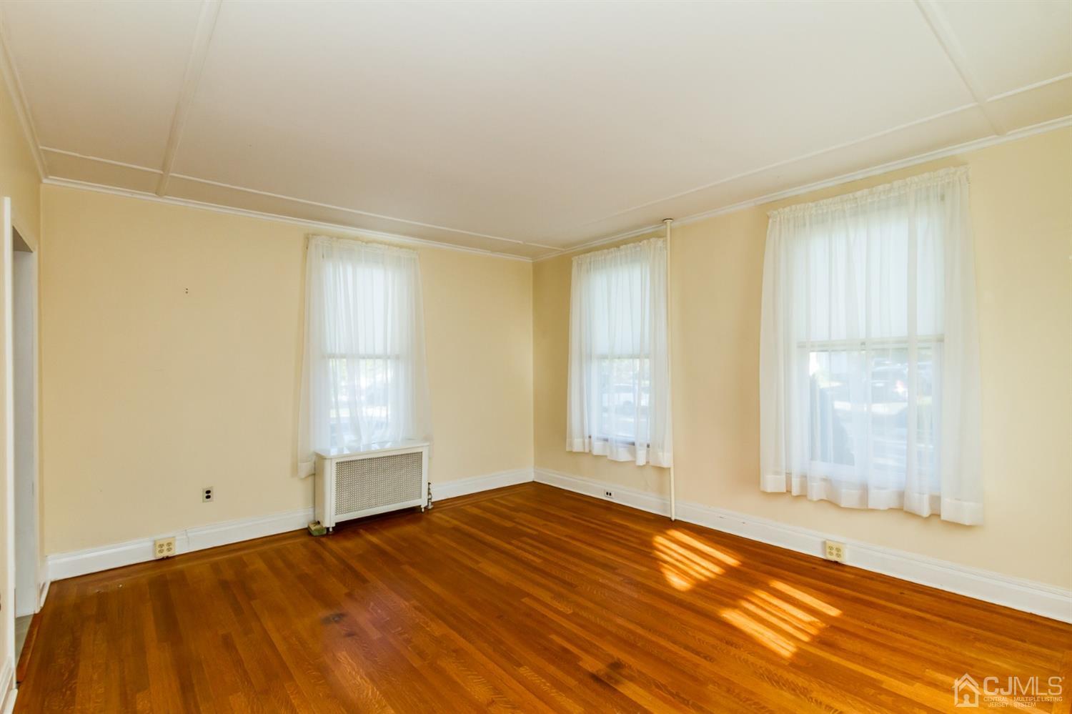 19 Kings Road Netcong, NJ 07857 - Photo 4 of 24 a view of empty room with wooden floor and fan