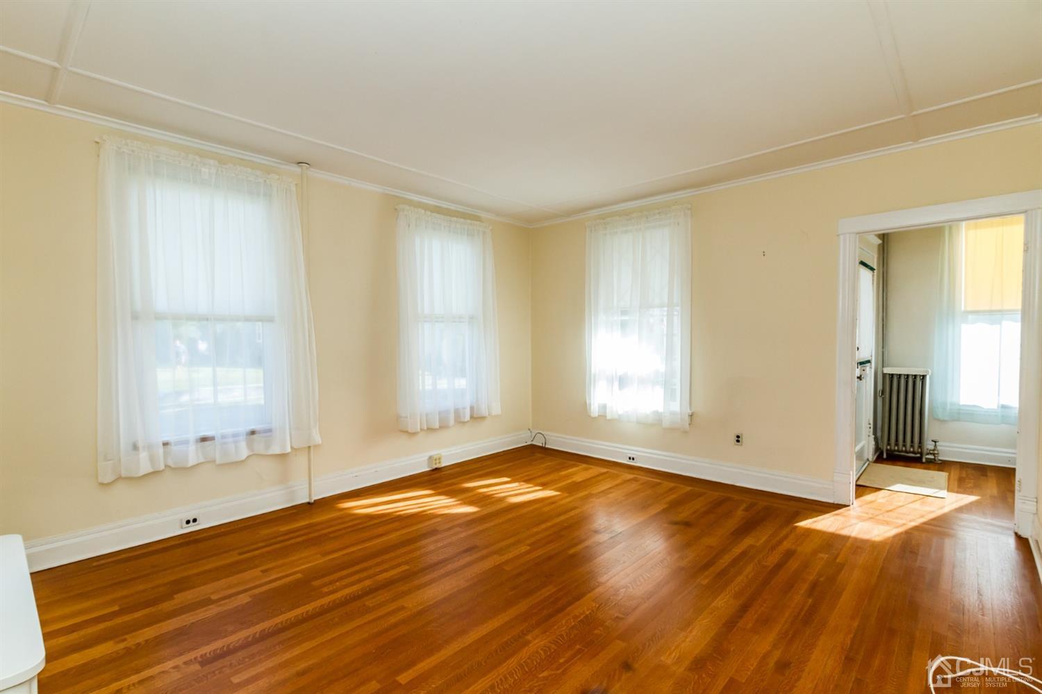 19 Kings Road Netcong, NJ 07857 - Photo 5 of 24 an empty room with wooden floor and windows