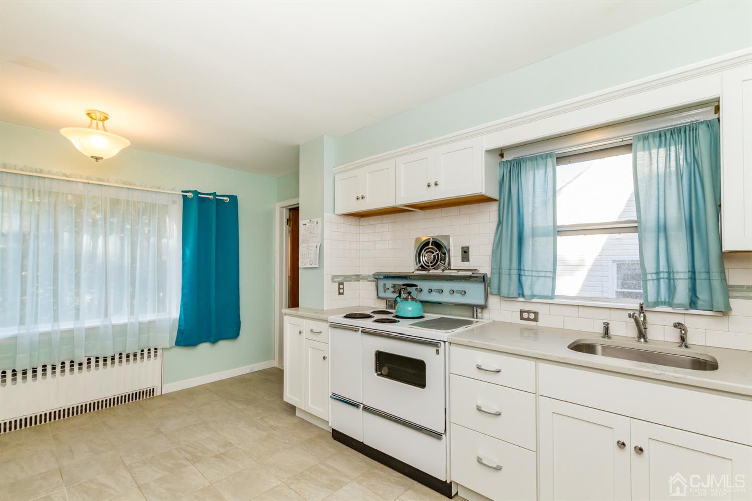 19 Kings Road Netcong, NJ 07857 - Photo 7 of 24 a kitchen that has a sink and a stove