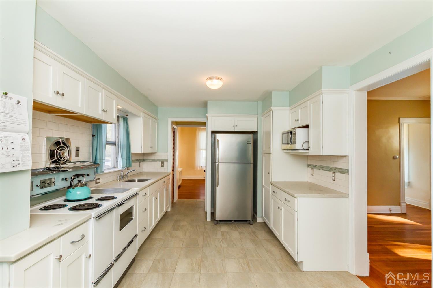 19 Kings Road Netcong, NJ 07857 - Photo 9 of 24 a kitchen with stainless steel appliances a sink stove refrigerator and cabinets