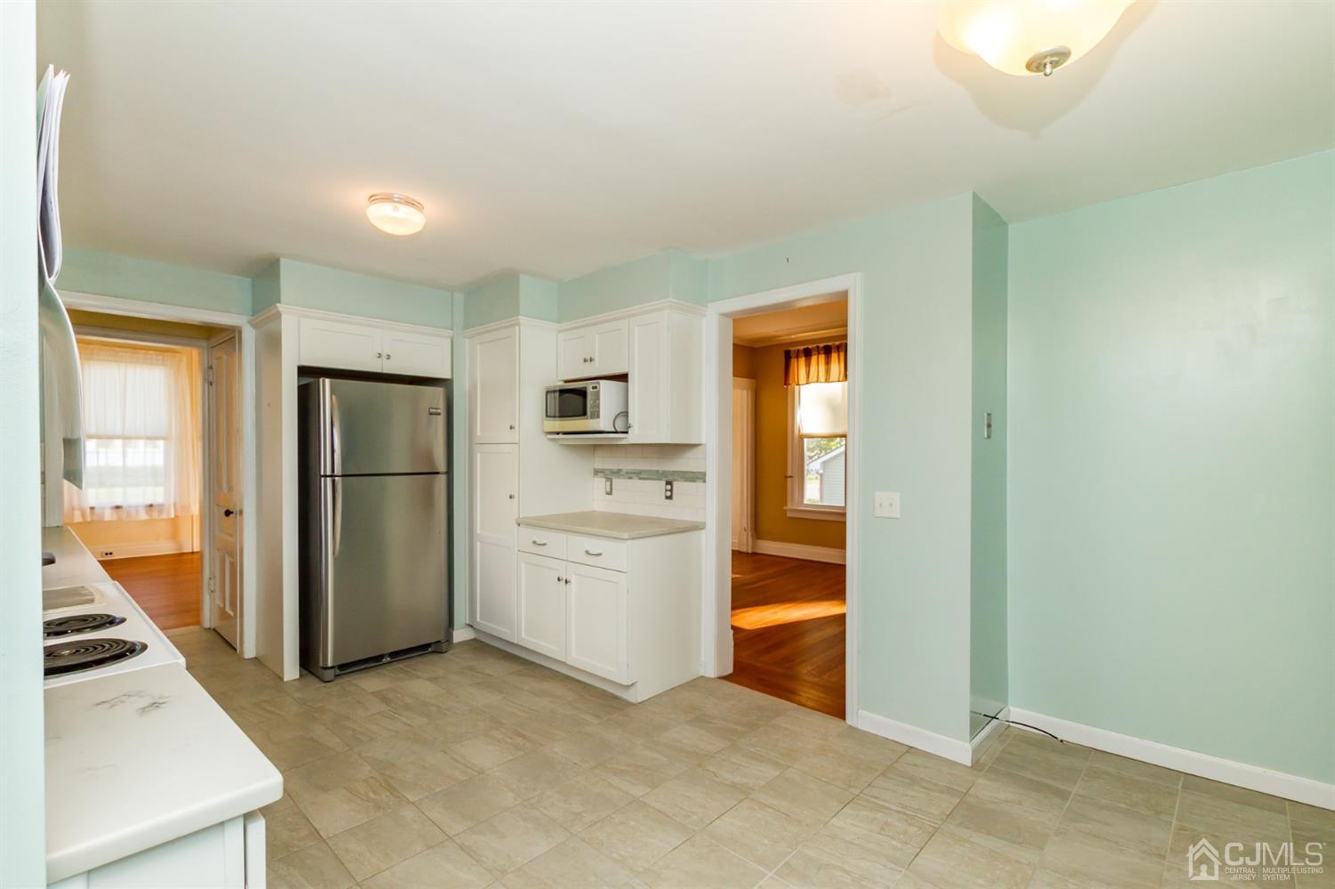 19 Kings Road Netcong, NJ 07857 - Photo 10 of 24 a view of a kitchen with an empty space and wooden floor
