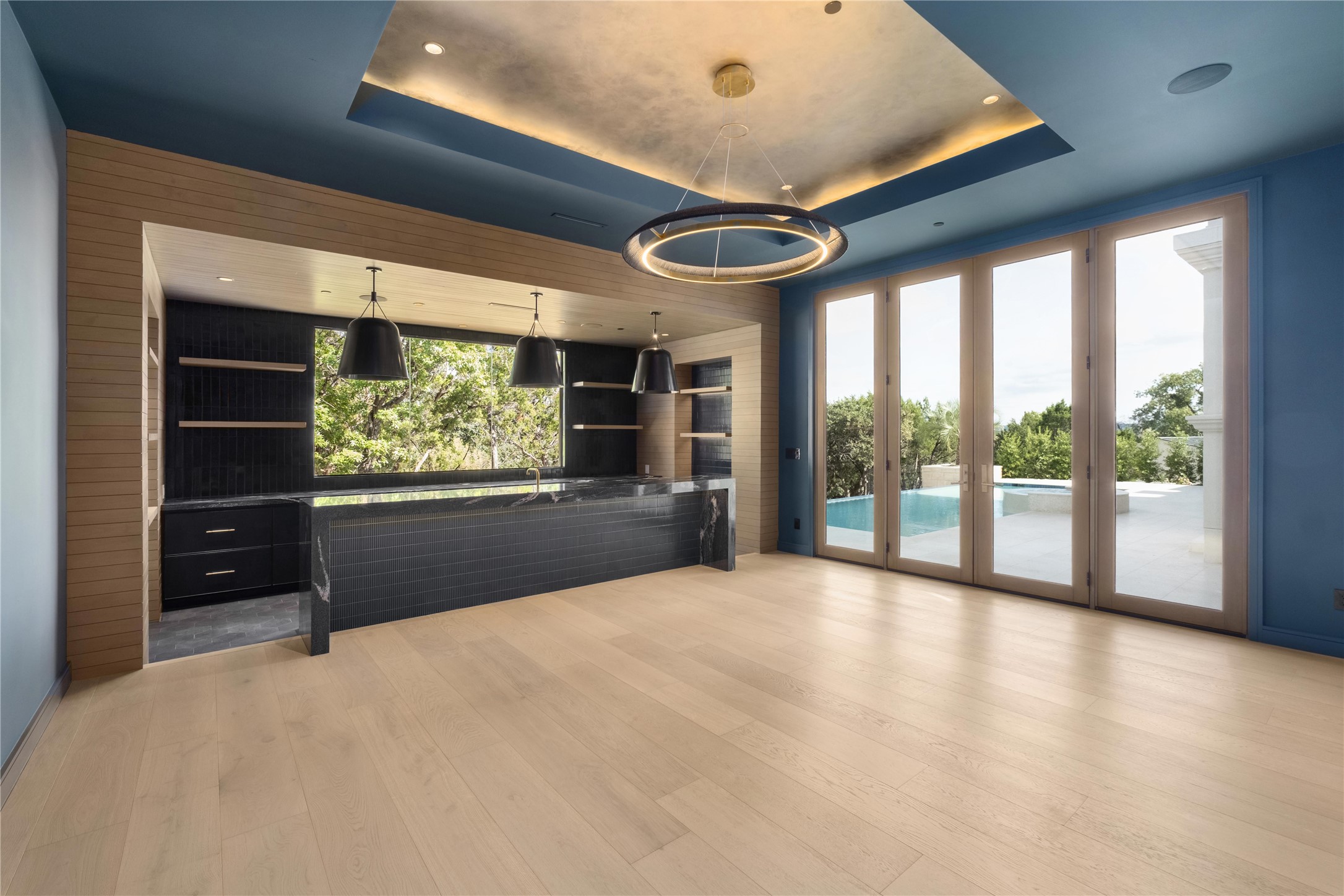 1104 Marly Way Austin, TX 78733 - Photo 7 of 13 a big room with wooden floor and windows