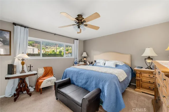 a bed room with furniture and a window