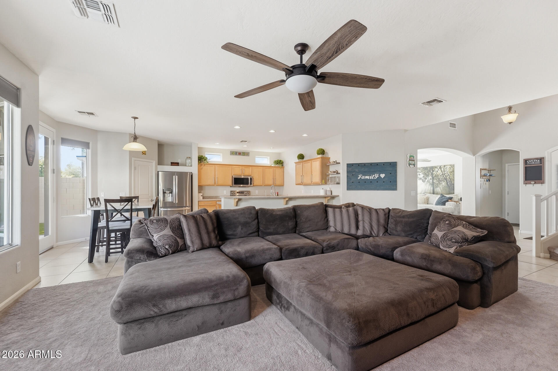 3273 East Fairview Street Gilbert, AZ 85295 - Photo 12 of 37 a living room with furniture and a view of kitchen