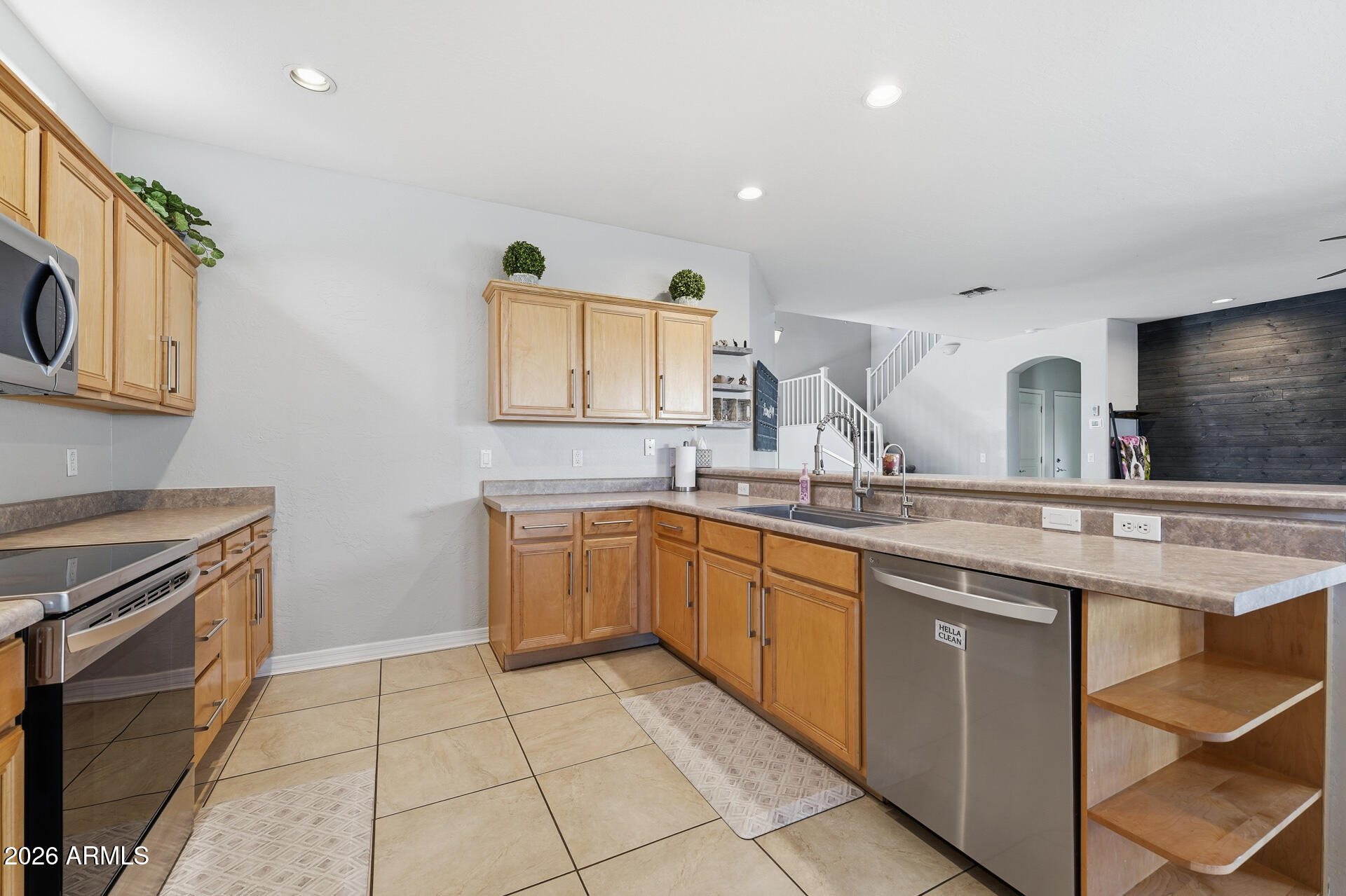 3273 East Fairview Street Gilbert, AZ 85295 - Photo 16 of 37 a kitchen with a sink stove and cabinets
