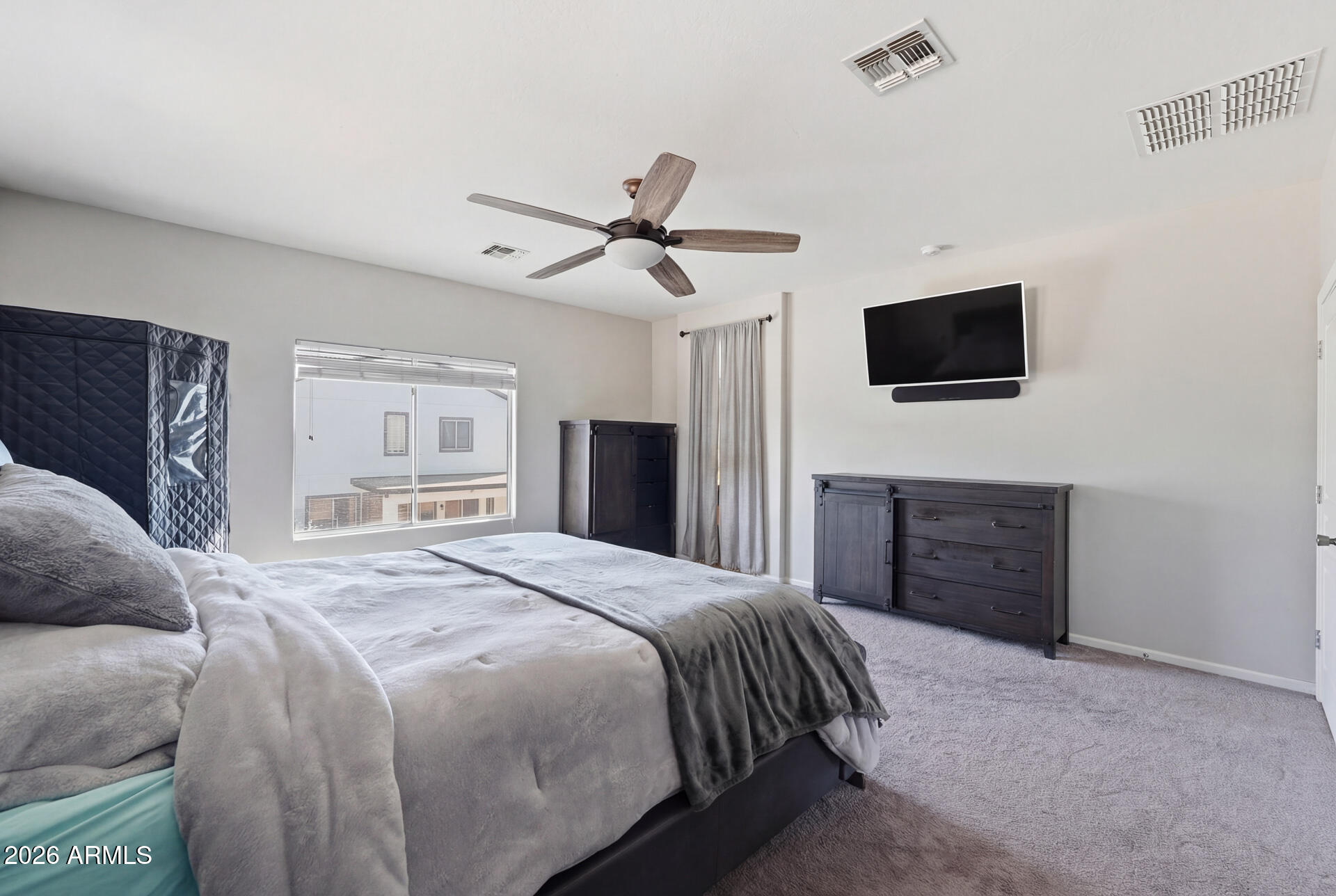 3273 East Fairview Street Gilbert, AZ 85295 - Photo 25 of 37 a bedroom with a bed and a flat screen tv