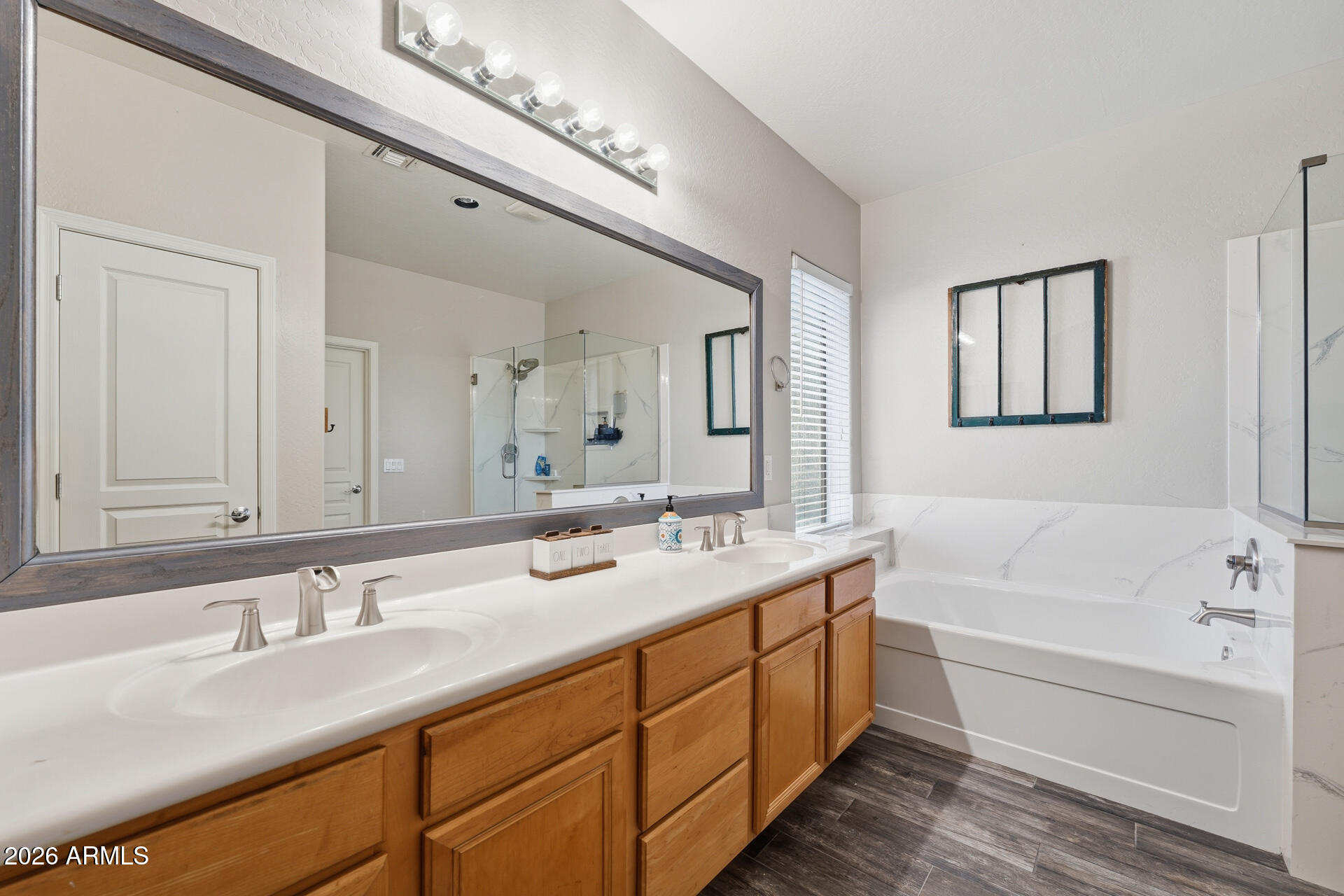 3273 East Fairview Street Gilbert, AZ 85295 - Photo 26 of 37 a bathroom with a tub double sink and mirror