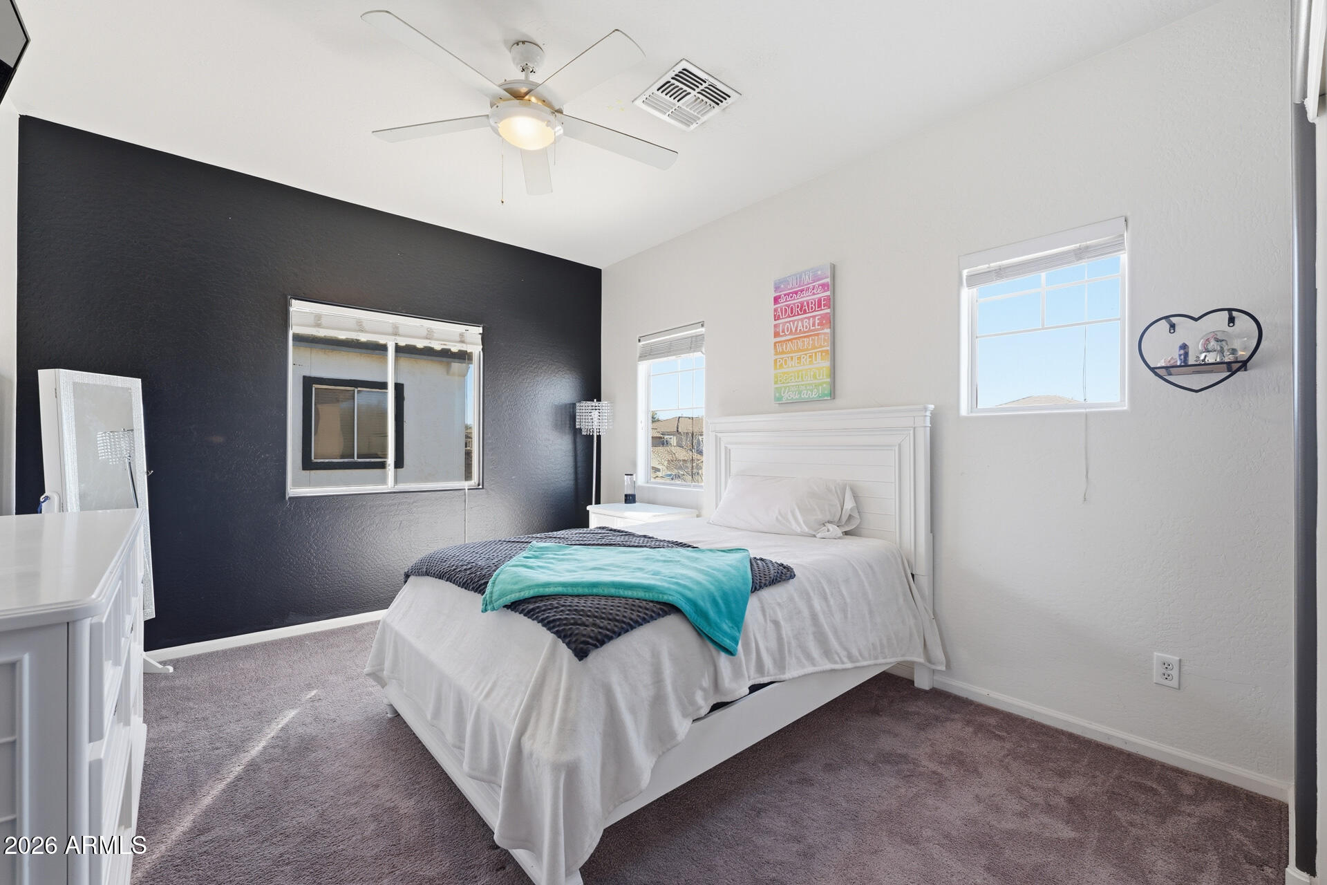 3273 East Fairview Street Gilbert, AZ 85295 - Photo 29 of 37 a bedroom with a bed and a chandelier