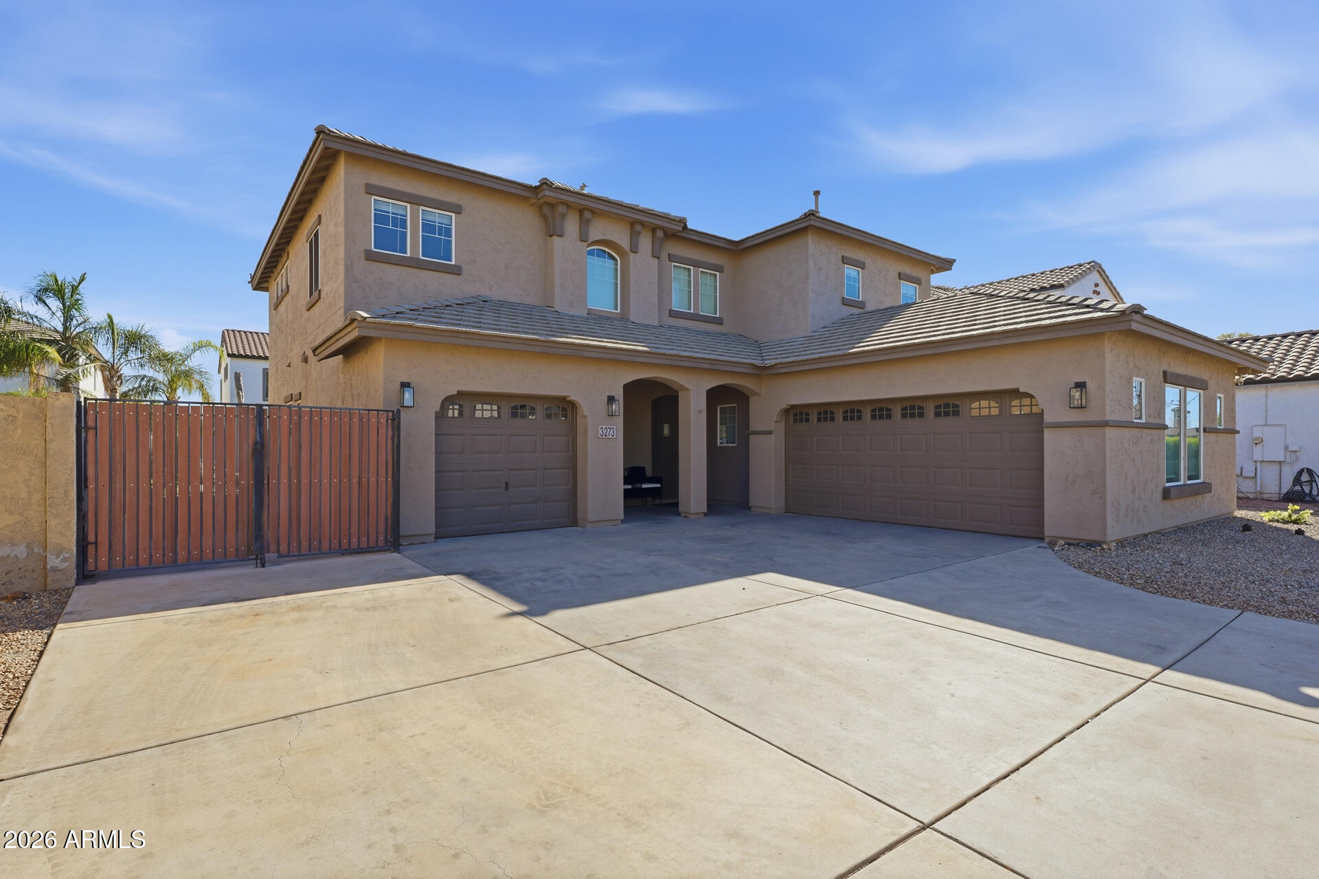 3273 East Fairview Street Gilbert, AZ 85295 - Photo 3 of 37 a front view of a house with a garage