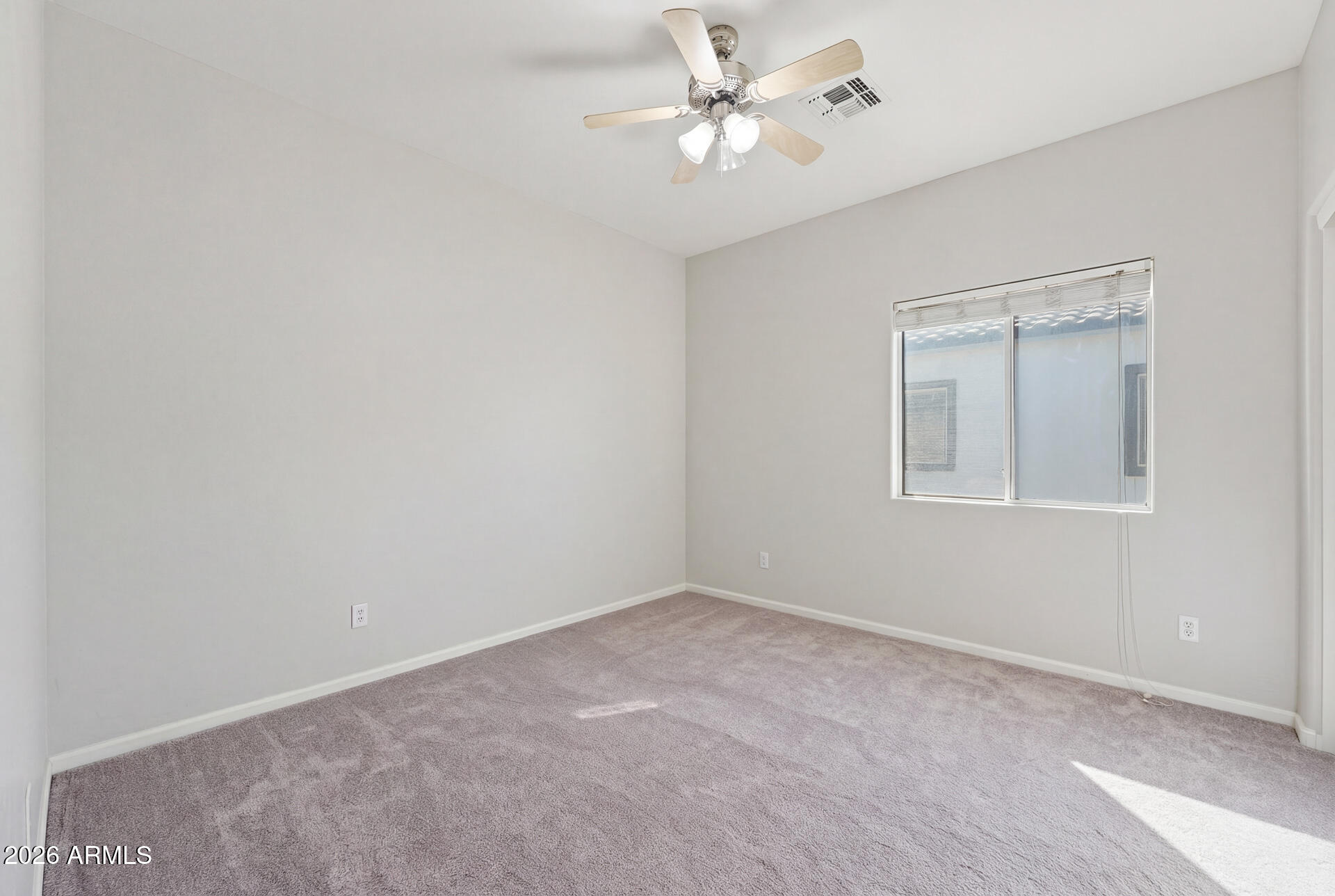 3273 East Fairview Street Gilbert, AZ 85295 - Photo 32 of 37 a view of an empty room with a fan