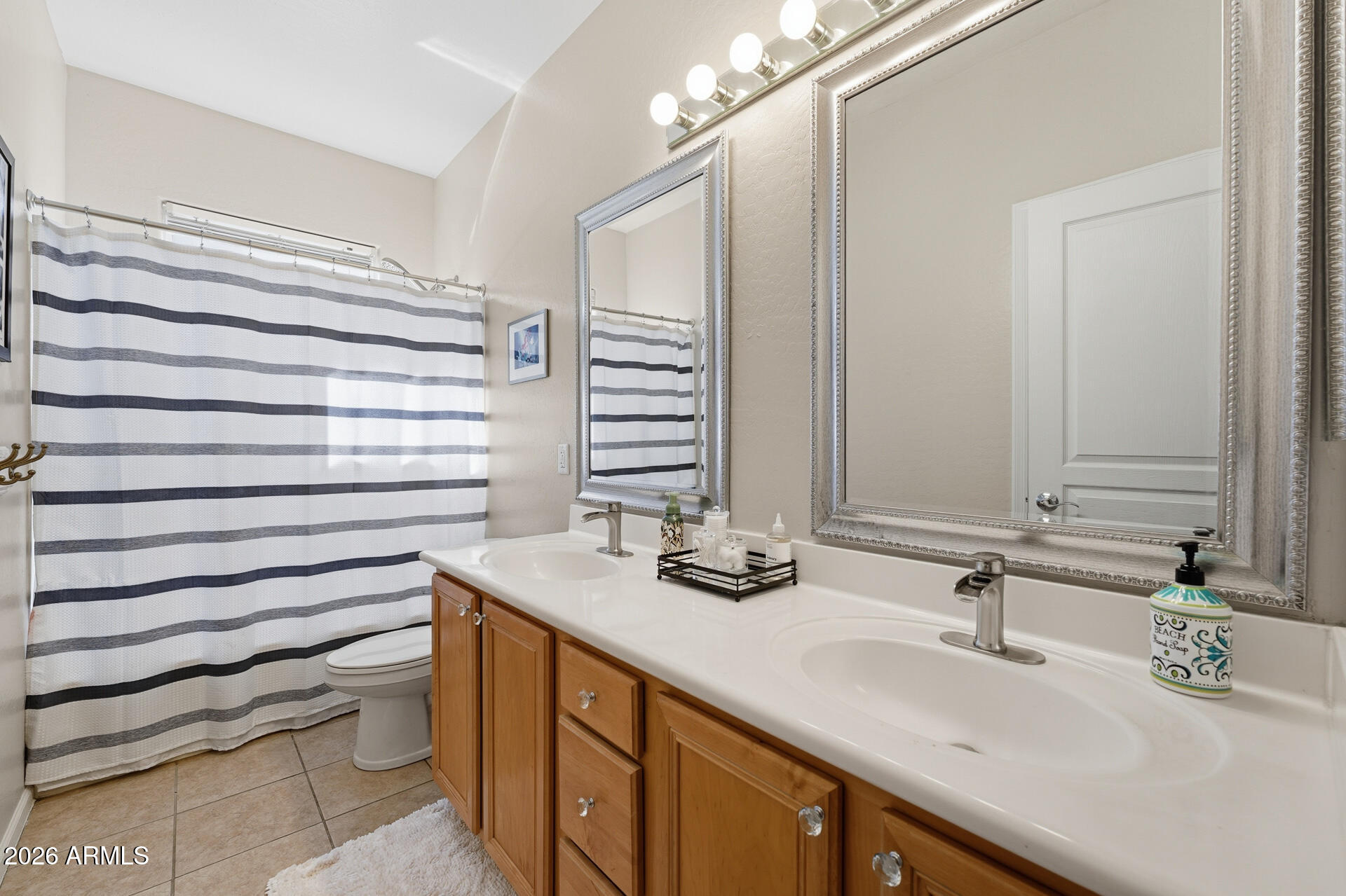 3273 East Fairview Street Gilbert, AZ 85295 - Photo 33 of 37 a bathroom with a sink and a mirror